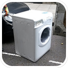 Washing machine waiting for disposal